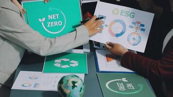 Business people working on net zero paper video