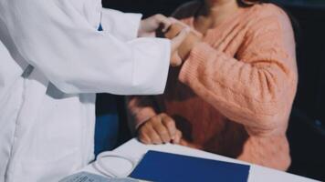 A doctor checking the pulse of a patient video