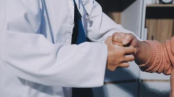 A doctor shaking hands with a patient video