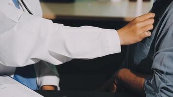 A doctor is examining a man's chest video
