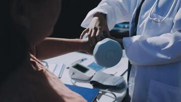 A doctor is checking the blood pressure of a patient video