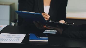 Two business people are working on a document video