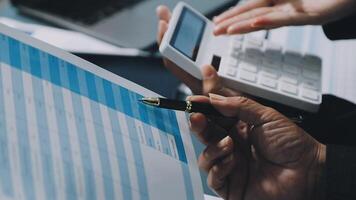 Business people using calculator and pen to calculate video