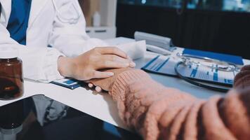 A doctor holding hands with a patient video