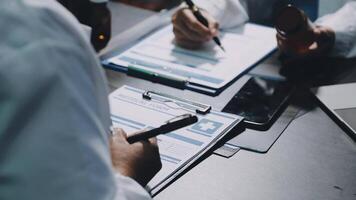 A doctor is writing on a clipboard video