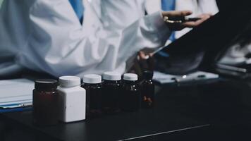 A group of doctors are holding bottles of medicine video