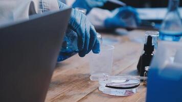 A person in a lab coat is working on a project video