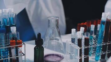 A laboratory table with several test tubes and bottles video