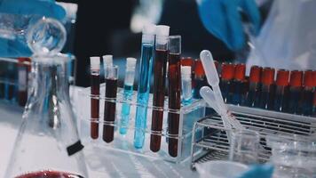 A laboratory with test tubes and red liquid video