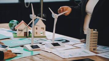 Two people are working on a project with wind turbines video