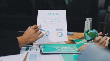 Business people working on a paper with eso on it video