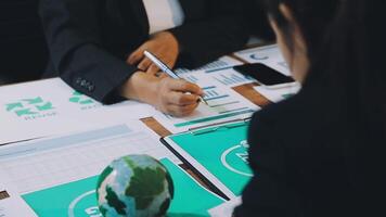 Business people working on a project at a table video
