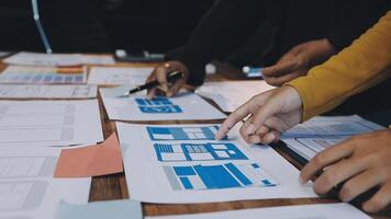 People working on a design project on paper video