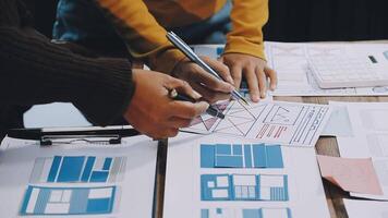 Two people working on a project with blueprints video