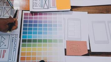 A person is working on a design project with a variety of colors video