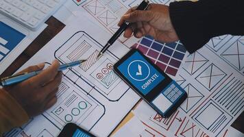 A person is using a smartphone to design a website video