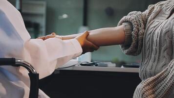 A doctor is shaking hands with a patient video