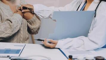 A woman is getting her chest checked by a doctor video