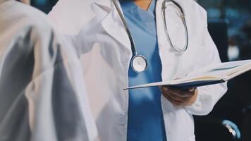 A doctor is talking to another doctor video