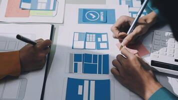 A person is working on a design project with a calculator and paper video