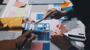 Two people working on a project with sticky notes video