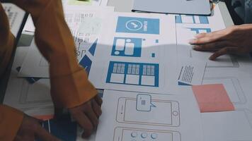People working on a design project on a table video