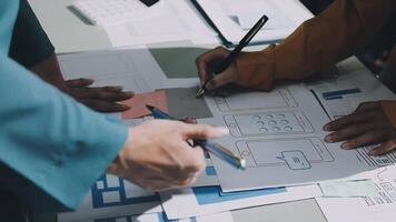 Two people working on a project with blueprints video
