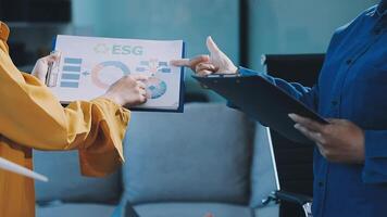 Two people are holding a folder with the word eeg on it video