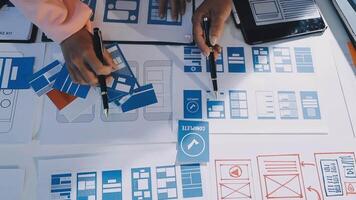 A person is working on a design document on a table video