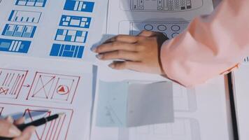 A person is working on a design document with a pen video