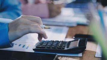 A person is using a calculator to do some calculations video