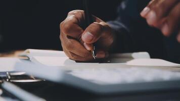 A person is writing on a piece of paper with a pen video