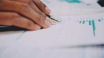 A person's hand writing on a paper with a pen video