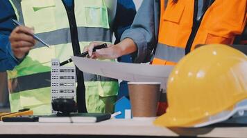 Two construction workers are working on a project video