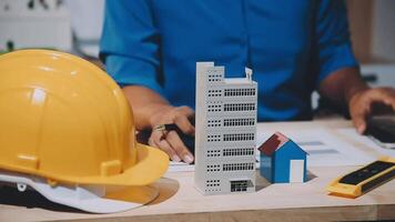 A person working on a construction project with a hardhat video