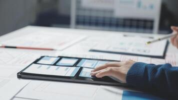 A person is using a tablet on a desk video