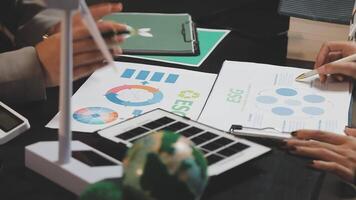 Business people working on papers with graphs and other information video