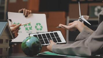 Recycling concept business people working on a laptop with a recycling symbol video