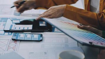 A person is working on a design project with a tablet video