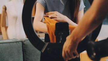 A woman is holding a mirror while standing in front of a man video