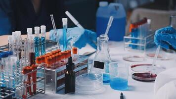 A laboratory with several test tubes and bottles video