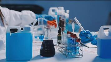 A woman in a lab coat is working on a project video