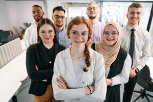 A group of business professionals standing together, taking a well-deserved break from their busy workday, showcasing camaraderie, teamwork, and a moment of relaxation in their dynamic workplace photo