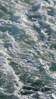 Turbulent, chaotic, foaming white water rushing past right to left at speed. View from above over side of Cruise ship in Atlantic Ocean near La Gomera, Canary islands. Day outdoors video
