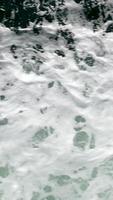 ocean waves overview in portugal Sea waves with foam near the shore. Sea surface aerial view 4K Beautiful texture of big power blue ocean waves with whitewash. Aerial top-view footage of sea video