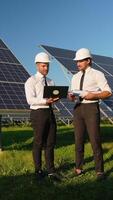 Two Engineers Discuss Solar Panel Performance on Site video