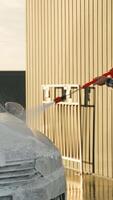Man Using Pressure Washer to Clean a Car with Soap Foam video
