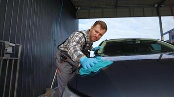 Car Wash Worker Polishing Car with Attention to Detail video