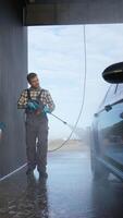 Worker Cleaning Car with High-Pressure Washer video