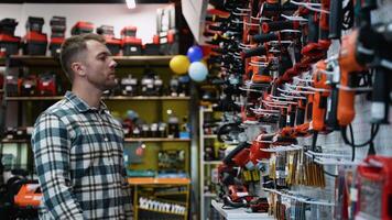 A Man Choosing a Screwdriver in Power Tool Store video